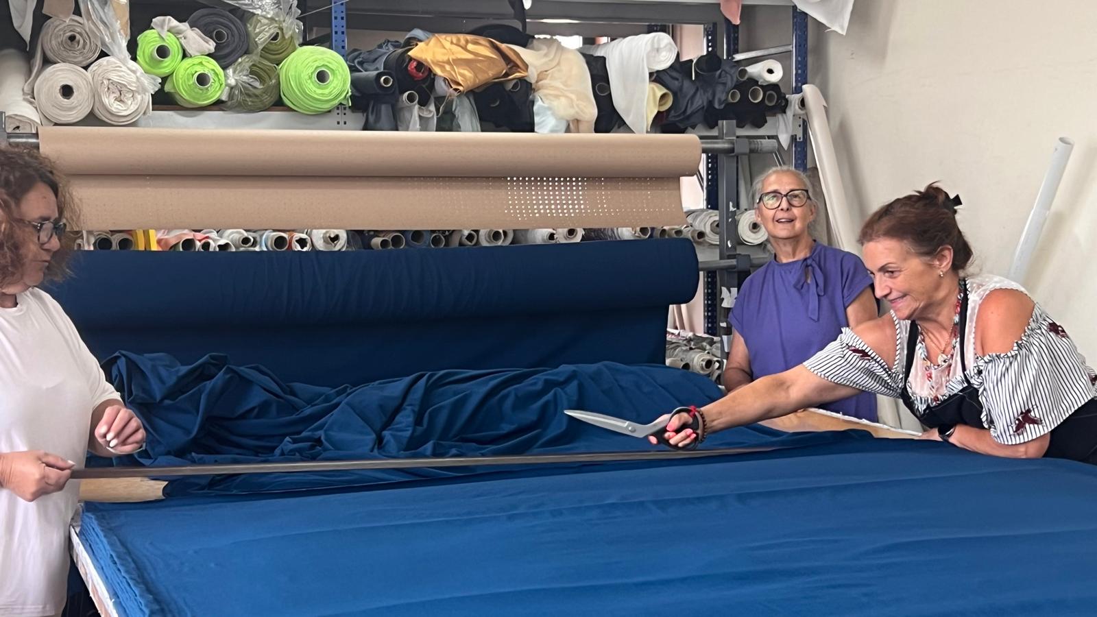 Seamstresses in Portugal producing garments within 70 km from yarn to finished product using solar energy.